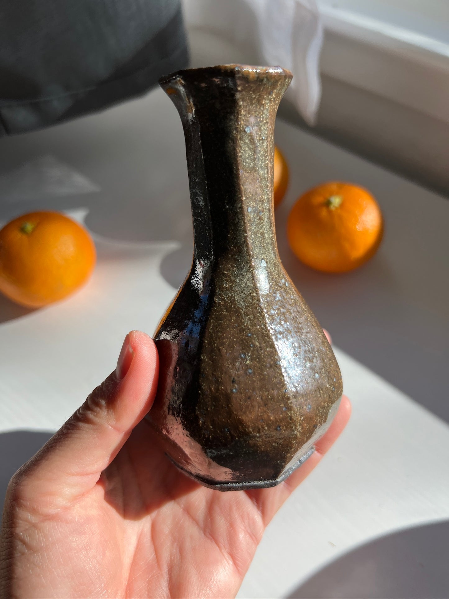 Faceted tall black mountain vase