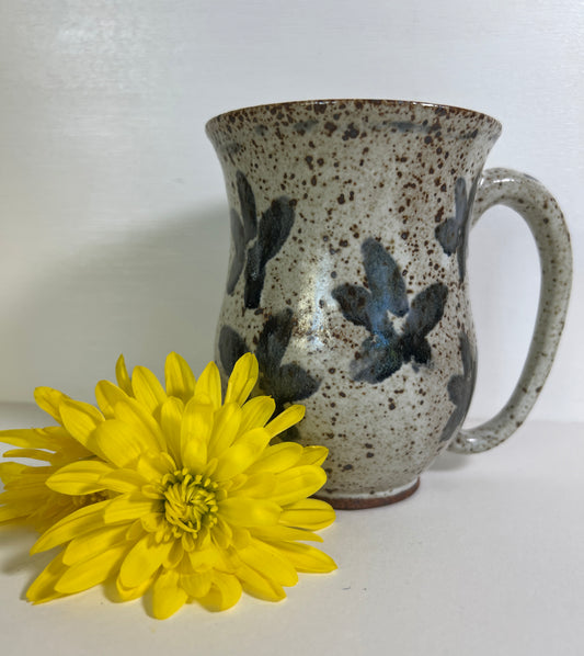 White Speckled Mug with Blue Floral Accents