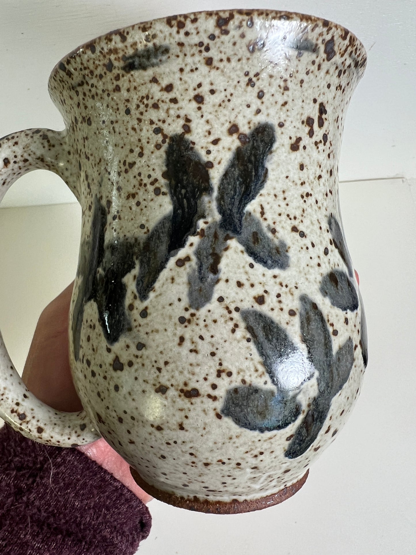 White Speckled Mug with Blue Floral Accents