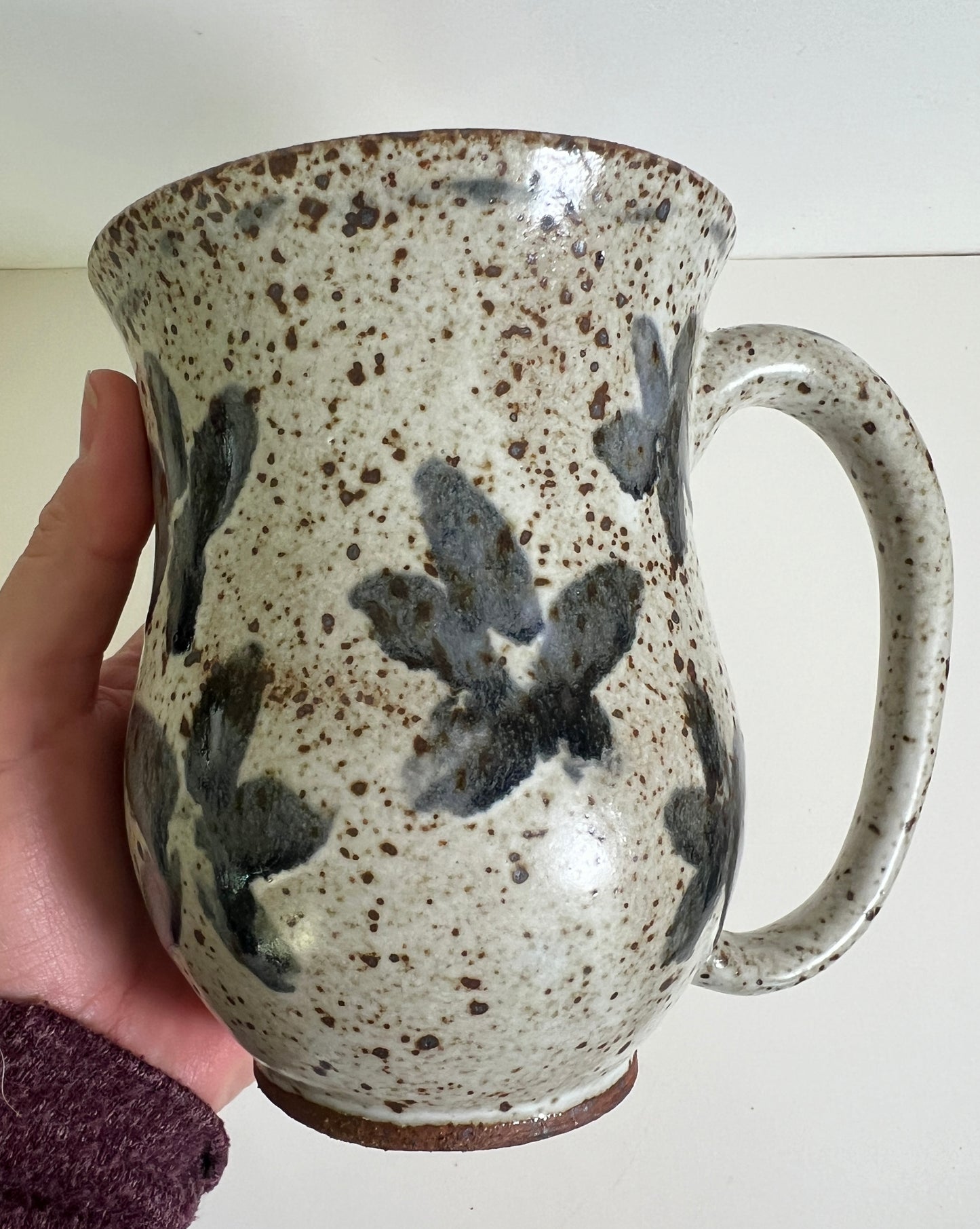 White Speckled Mug with Blue Floral Accents